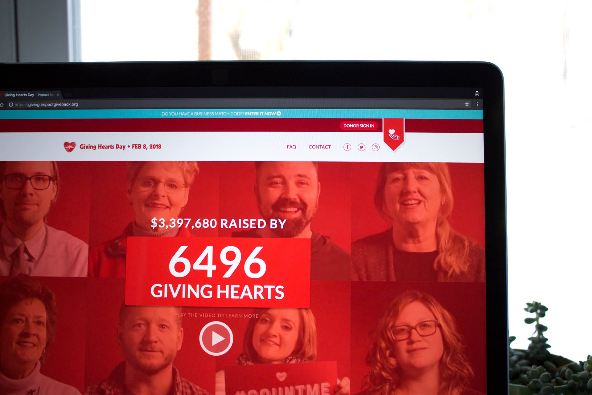 Close-up of laptop screen displaying live counter of donors on Giving Hearts Day