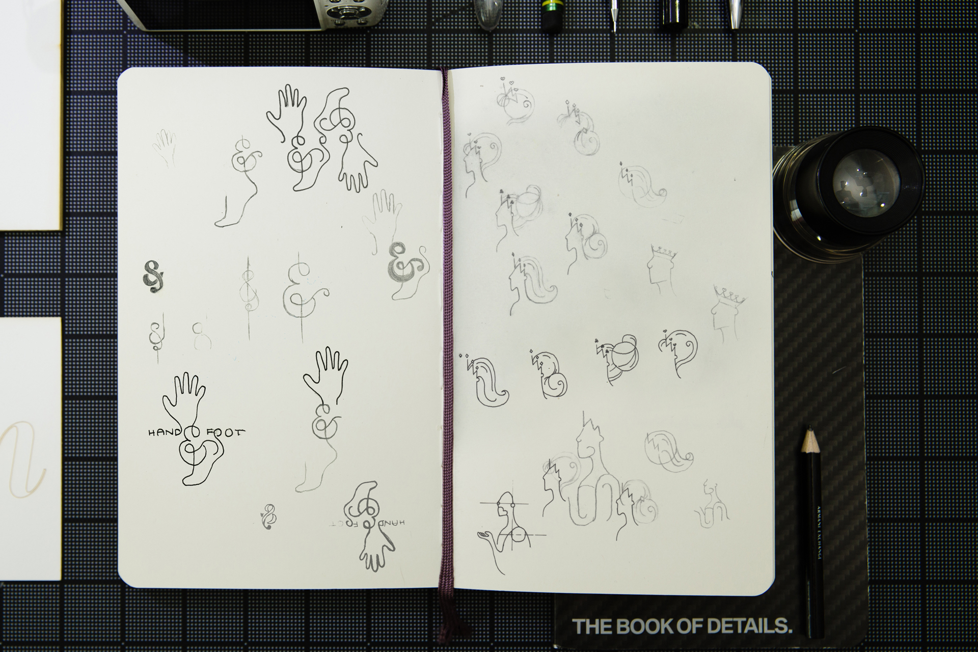 Sketchbook featuring logo concept sketches