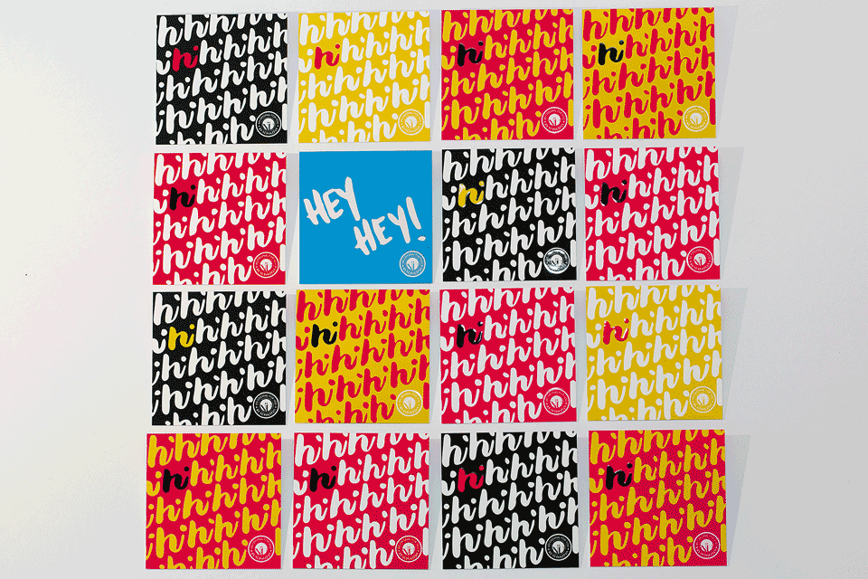 A grid of 16 square, colorful cards on a white background