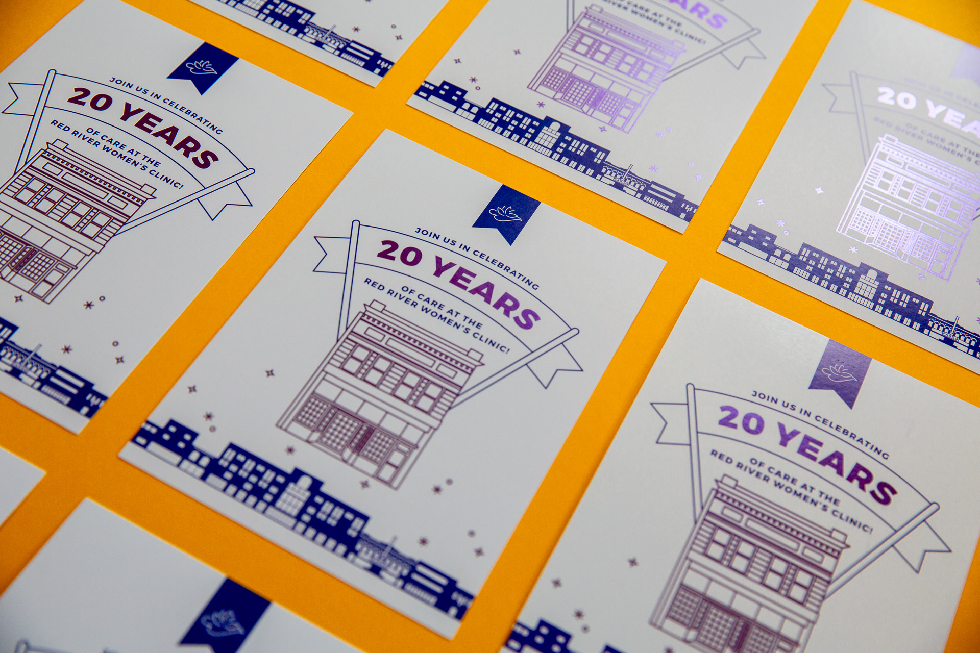 Grid of white postcards with purple illustration and lettering on a yellow background